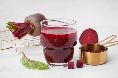 Glass of fresh beetroot juice on white backgroundの写真素材