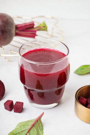 Glass of fresh beetroot juice on white backgroundの写真素材