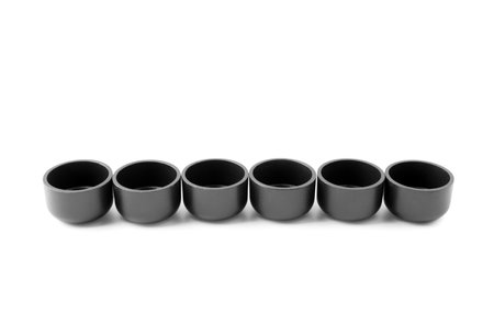 Black tea light candle holders on white backgroundの写真素材