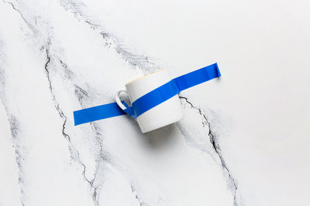 Cup with adhesive tape on grunge backgroundの写真素材