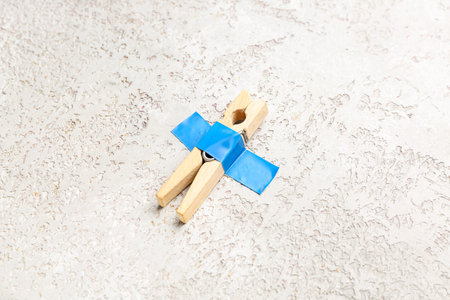 Clothespin with adhesive tape on grunge backgroundの写真素材