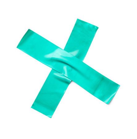 Cross made of adhesive tape on white backgroundの写真素材