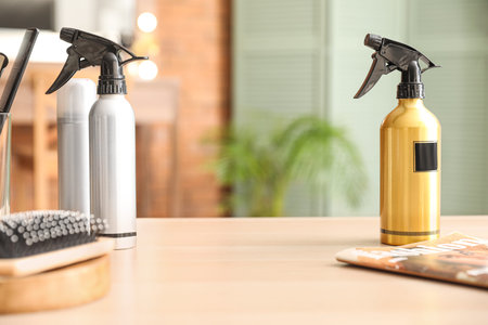 Bottles of spray on table in beauty salonの写真素材