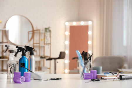 Different hairdressing tools on table in beauty salonの写真素材