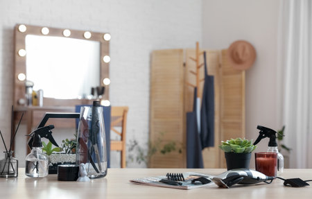 Different hairdressing tools on table in beauty salonの写真素材