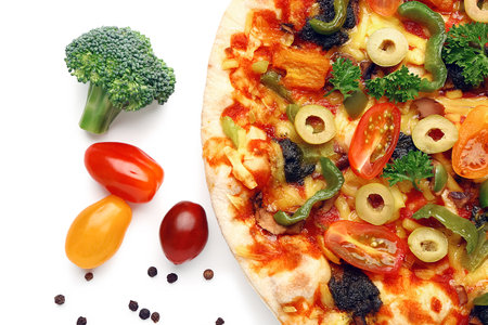 Vegetable pizza with ingredients on white backgroundの写真素材