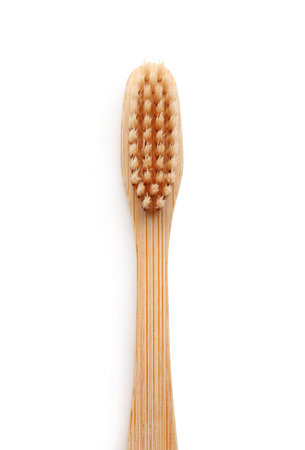 Bamboo toothbrush on white background