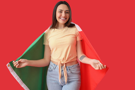 Young woman with flag of Italy on red backgroundの写真素材