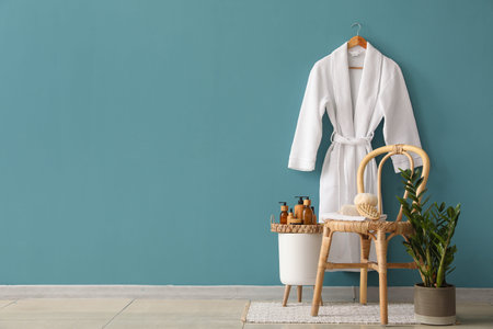 Interior of bathroom with stool, table and accessories