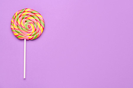 Colorful lollipop on purple backgroundの写真素材