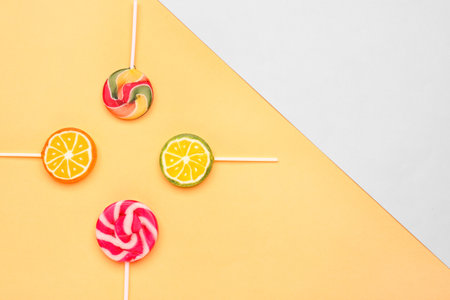 Sweet lollipops on beige and gray backgroundの写真素材