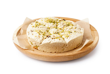 Plate of tasty Tahini halva with pistachios on white backgroundの写真素材