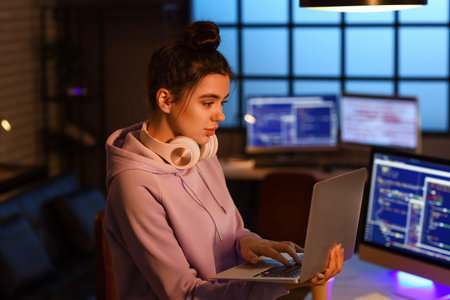 Young female programmer working in office