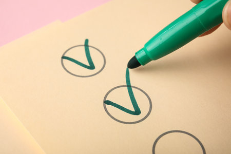 Green pen marking on checklist box, closeupの写真素材