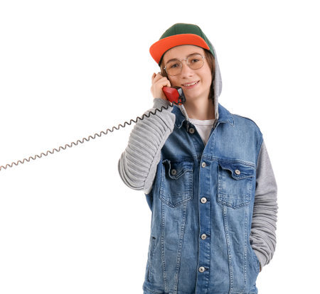 Cool teenage boy talking by telephone on white backgroundの写真素材