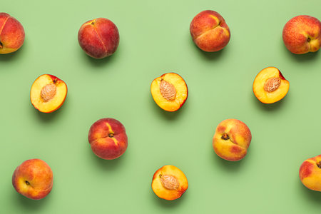 Many sweet peaches on green backgroundの写真素材