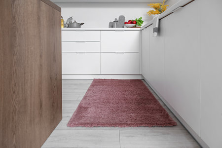 Stylish brown carpet in interior of modern kitchenの写真素材
