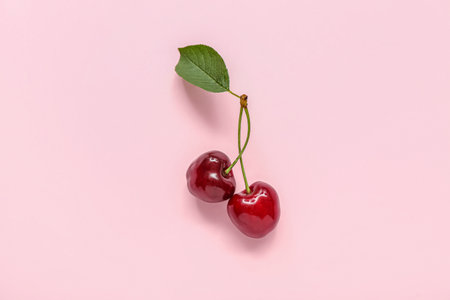 sweet cherry on pink backgroundの写真素材
