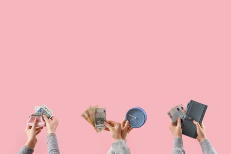 Women with money, wallets and clock on pink backgroundの写真素材