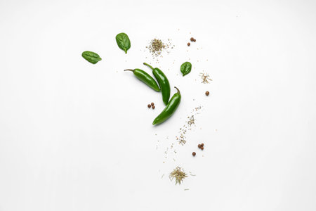 Composition with fresh chili peppers and spices on light background