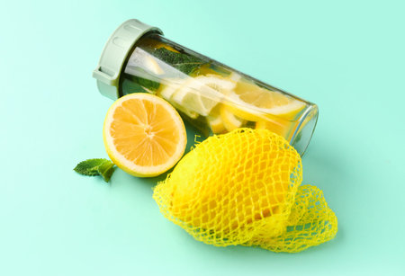 Sports bottle of infused water with lemon and mint on blue backgroundの写真素材