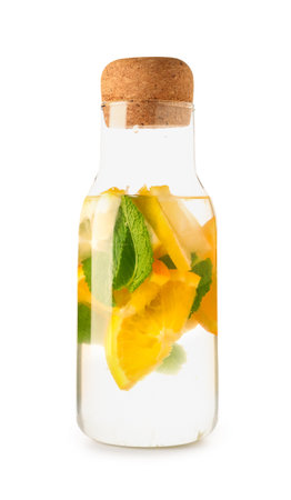 Bottle of infused water with lemon and mint on white backgroundの写真素材