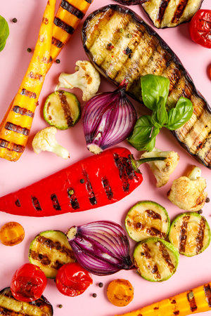 Grilled vegetables on pink backgroundの写真素材