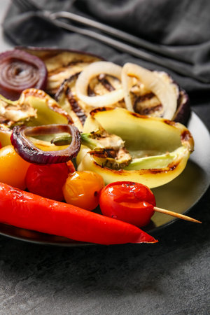 Plate with tasty grilled vegetables on black backgroundの写真素材
