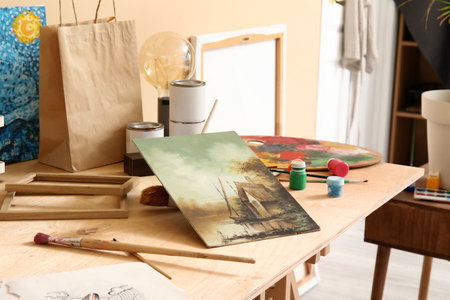 Table with artist's supplies in studioの写真素材