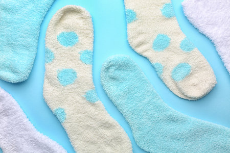 Set of warm socks on color background, closeupの写真素材