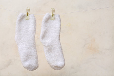 Pair of soft socks on light backgroundの写真素材
