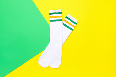 Pair of soft cotton socks on color backgroundの写真素材