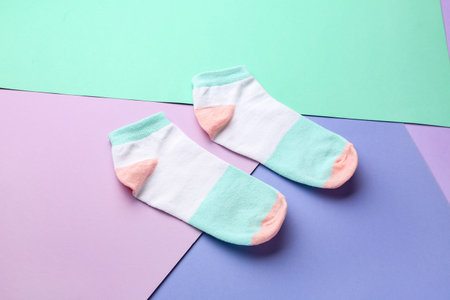 Cotton socks on color background