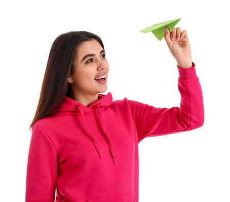 Young woman with paper plane on white backgroundの写真素材
