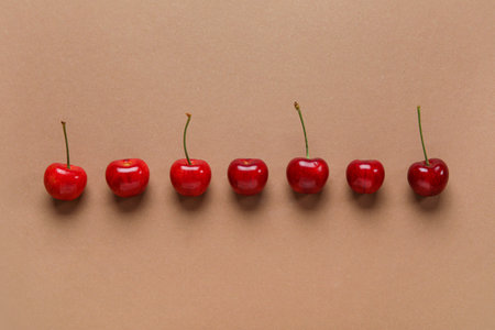 Many sweet cherries on brown backgroundの写真素材