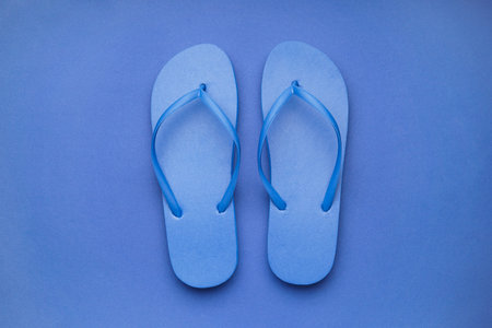 Blue flip-flops on color backgroundの写真素材