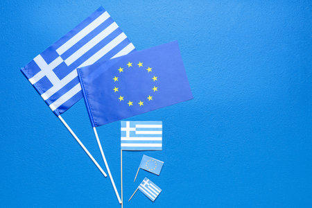 Different flags of Europe and Greece on blue backgroundの写真素材