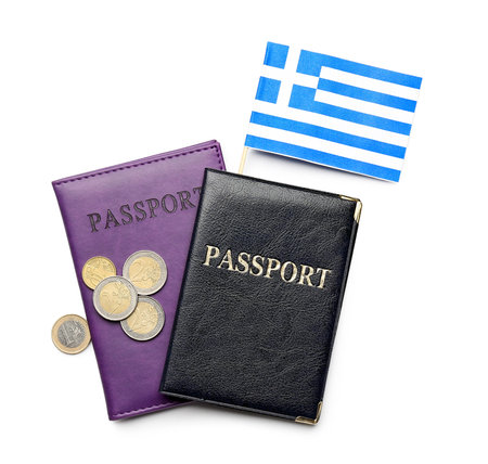Flag of Greece, passports and euro coins isolated on white backgroundの写真素材