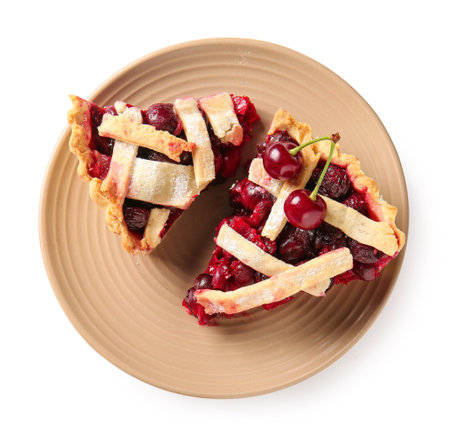 Plate with pieces of tasty cherry pie on white backgroundの写真素材
