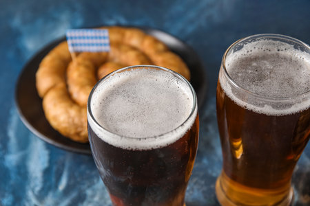 Glasses of cold beer on blue background.の写真素材
