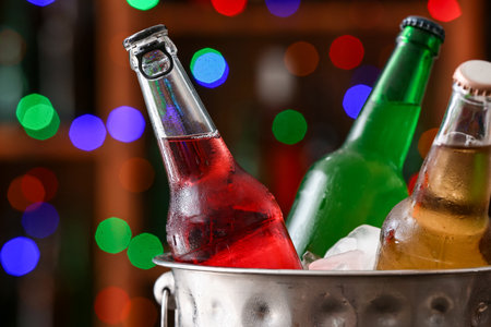 Bucket with bottles of cold beer in bar, closeupの写真素材