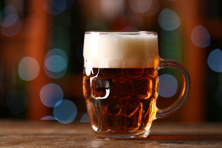 Mug of beer on table in bar. celebrationの写真素材