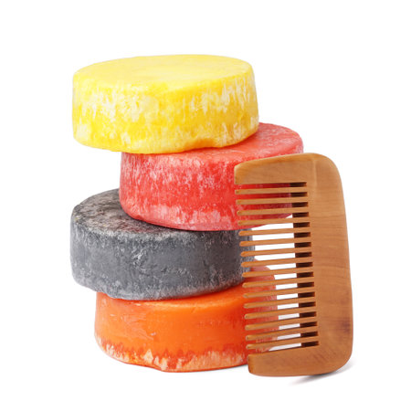 Colorful solid shampoo bars with comb on white backgroundの写真素材