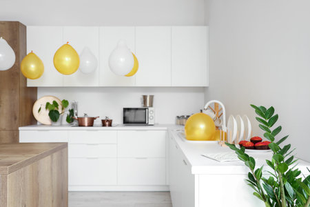 Interior of light kitchen decorated for Birthday partyの写真素材