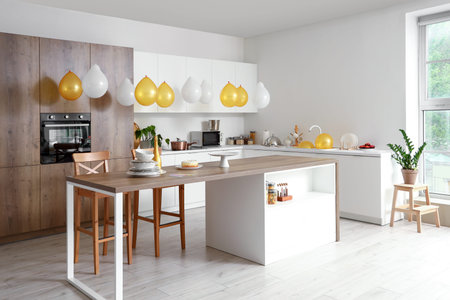 Interior of light kitchen decorated for Birthday party