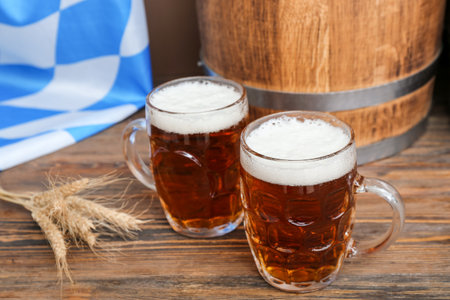 Mugs of cold beer on table.の写真素材