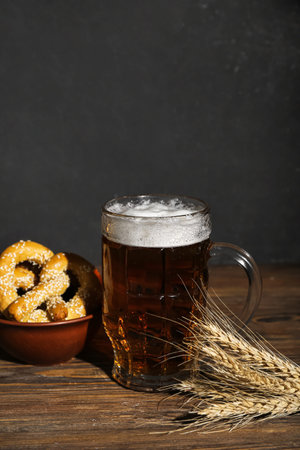 Mug of cold beer and pretzels on table. celebrationの写真素材