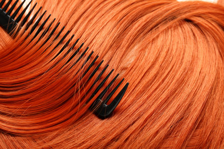 Ginger hair with comb, closeupの写真素材