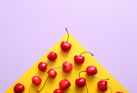 Many sweet cherries on colorful backgroundの写真素材
