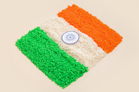 Indian flag made of rice on beige background